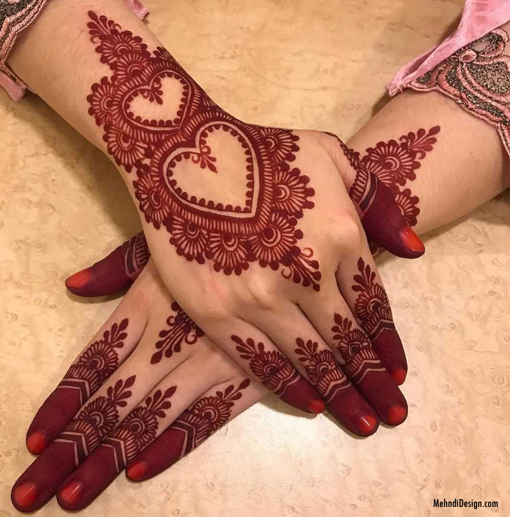 arabic mehndi design with red henna forehand